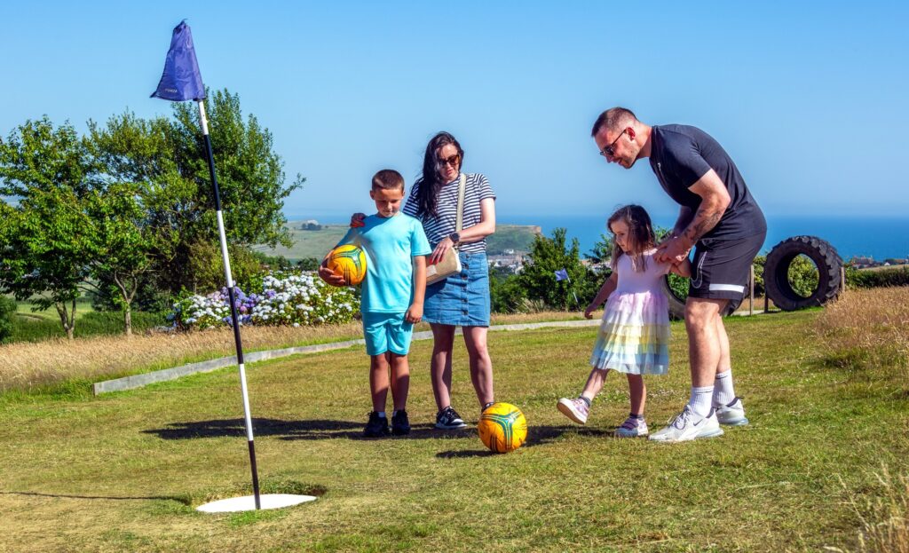 family playing footgolf at highlands end holiday park