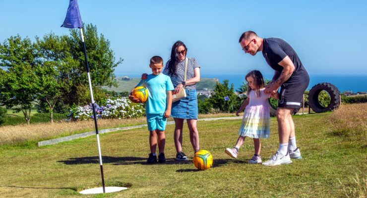family playing footgolf at highlands end holiday park